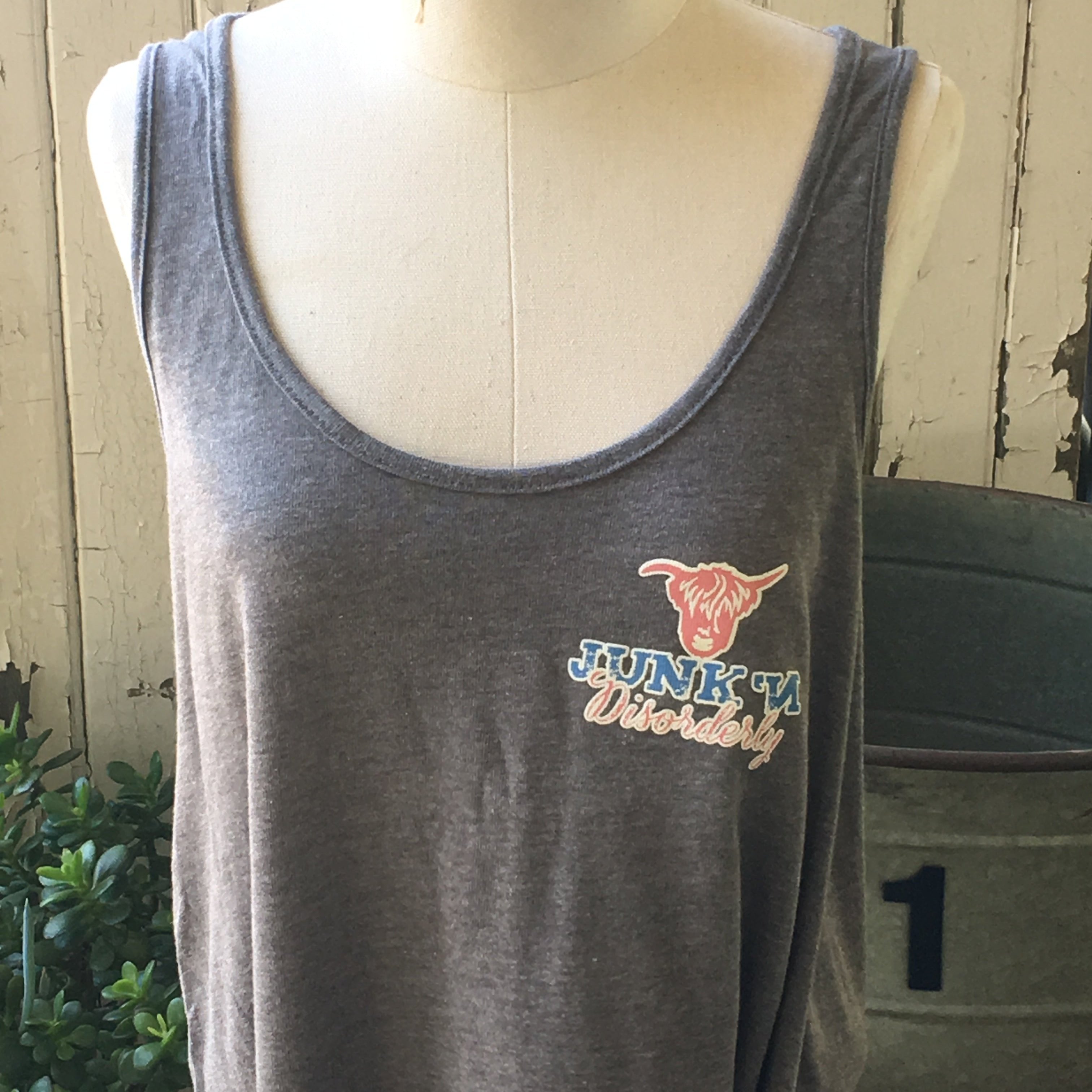 A gray tank top with a scoop neckline, displaying a logo on the front.
